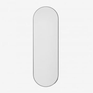 Miroir mural Nuseiva ovale noir avec cadre MDF, présenté en pied
